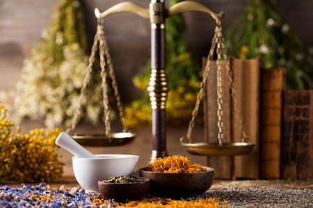 Fresh medicinal, healing herbs on woodenの写真素材
