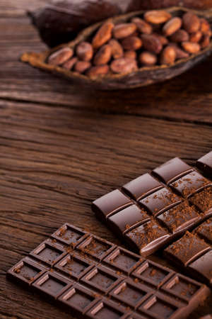 Aromatic cocoa and chocolate on wooden backgroundの写真素材