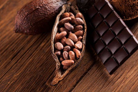 Aromatic cocoa and chocolate on wooden backgroundの写真素材