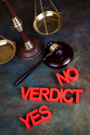 Law theme, mallet of the judge, justice scale, wooden desk backgroundの写真素材