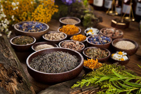 Natural medicine on wooden table backgroundの写真素材