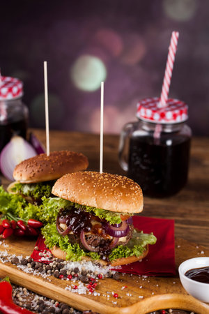 Fast food hamburge, wooden desk backgroundの写真素材