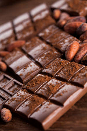 Aromatic cocoa and chocolate on wooden backgroundの写真素材
