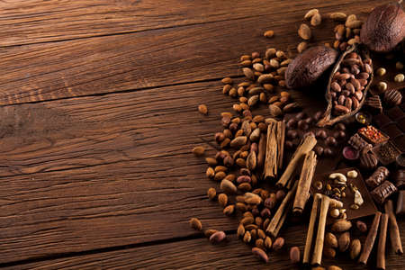 Chocolate sweet, cocoa pod and food dessert backgroundの写真素材