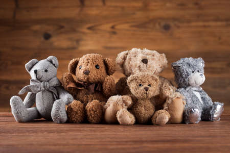Teddy bears on on wooden backgroundの写真素材