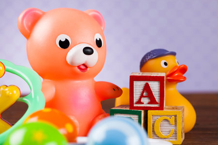 Baby World toy collection on on wooden background