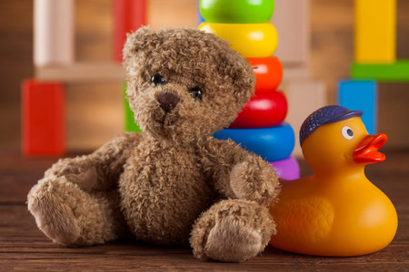 Cute teddy bear on wooden backgroundの写真素材