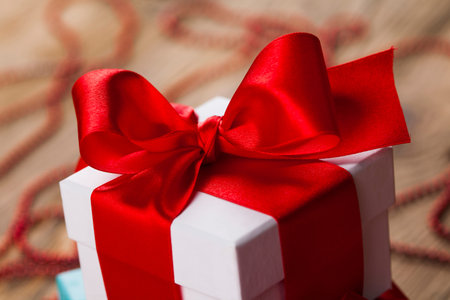 Gift box with red ribbon, Holiday Christmas background