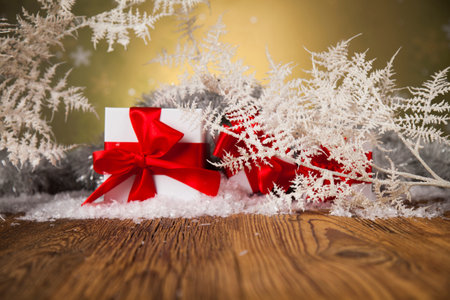 Christmas presents with red ribbon on wooden