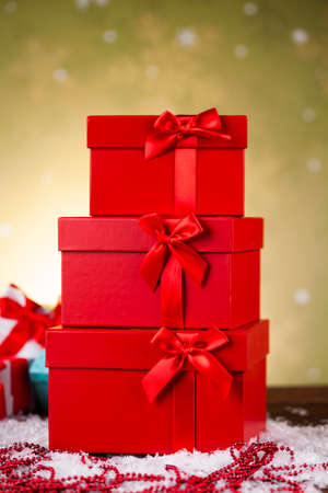 Gift boxes with red ribbon on Christmas backgroundの写真素材