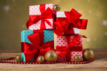 Gift boxes with red ribbon on Christmas background