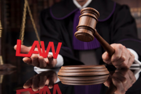 law theme, mallet of the judge, wooden desk, scales of justice