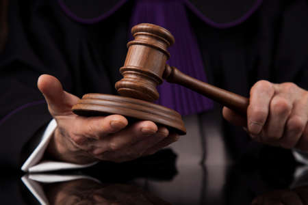 Courtroom, Judge, male judge in black mirror backgroundの写真素材