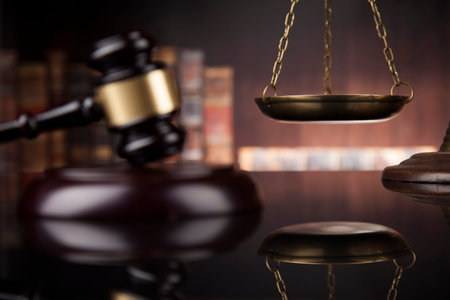 Law theme, mallet of the judge, wooden desk, books