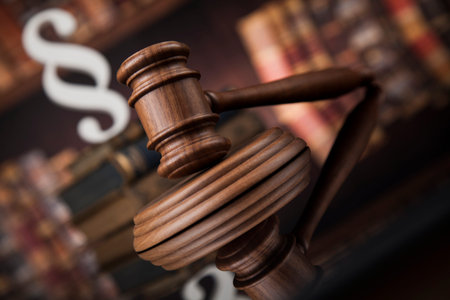 Paragraph, law and justice concept, wooden gavel, mirror background