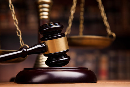 law theme, mallet of the judge, justice scale, books, wooden desk