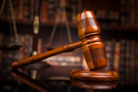 law theme, mallet of the judge, justice scale, books, wooden desk