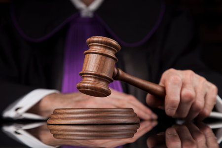 law theme, mallet of the judge, wooden desk, scales of justice