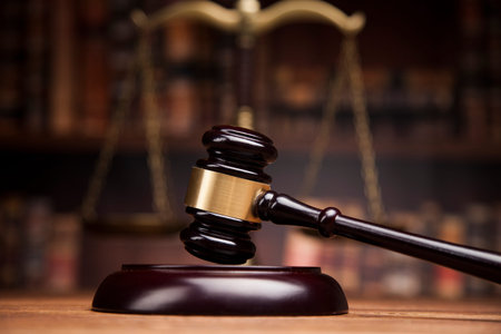 law theme, mallet of the judge, justice scale, books, wooden desk