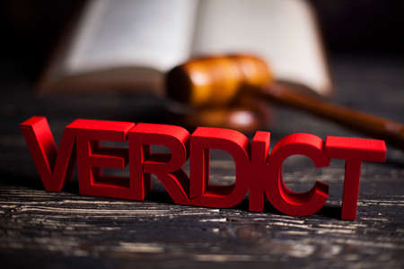 Law theme, mallet of the judge, justice scale, wooden desk backgroundの写真素材