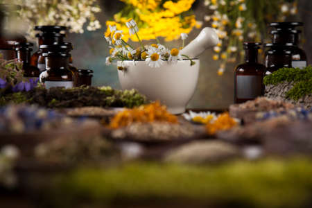 Natural remedy and mortar, healing herbs backgroundの写真素材