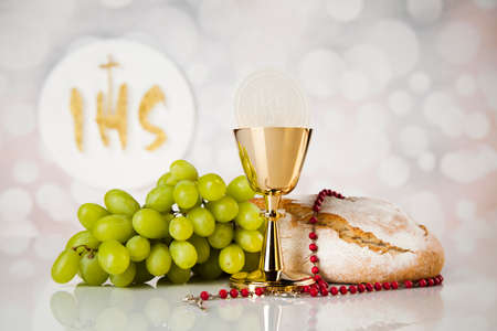 Holy communion a golden chalice, composition isolated on whiteの写真素材