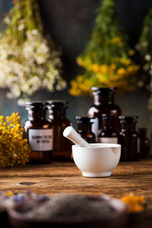 Fresh medicinal, healing herbs on woodenの写真素材