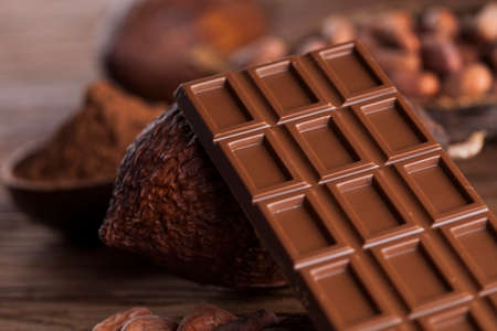 Aromatic cocoa and chocolate on wooden backgroundの写真素材