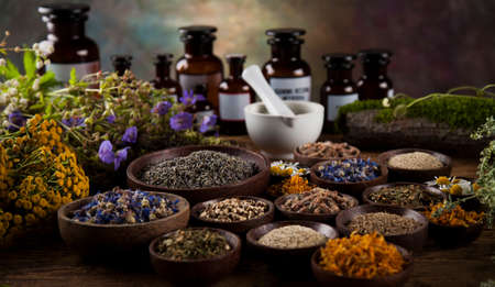 Natural medicine on wooden table backgroundの写真素材