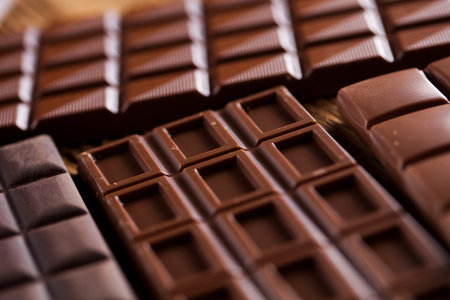 Bars Chocolate , candy sweet, dessert food on wooden background