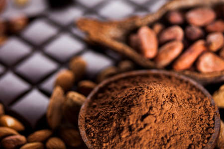 Chocolate sweet, cocoa pod and food dessert backgroundの写真素材