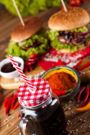 Fast food hamburge, wooden desk backgroundの写真素材