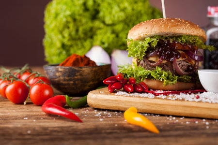 Close-up of home made burgers, wooden desk backgroundの写真素材