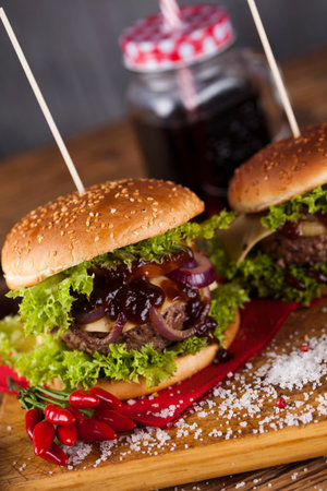 Fast food hamburge, wooden desk backgroundの写真素材