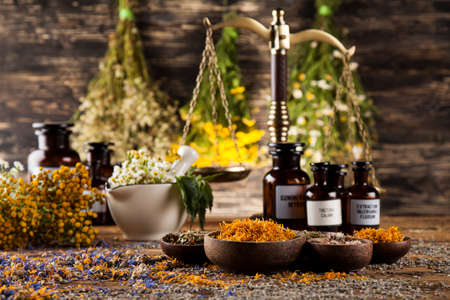Natural medicine on wooden table backgroundの写真素材