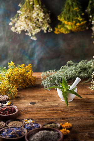 Natural medicine on wooden table backgroundの写真素材