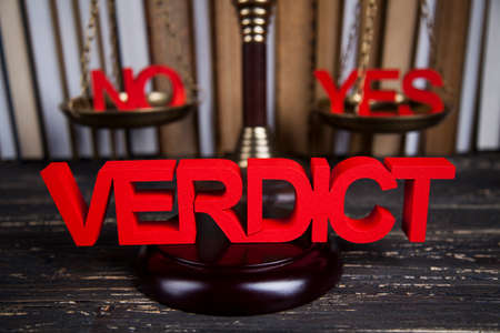 Law theme, mallet of the judge, justice scale, wooden desk backgroundの写真素材