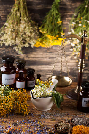 Natural medicine on wooden table backgroundの写真素材