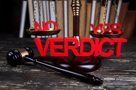 Law theme, mallet of the judge, justice scale, wooden desk background