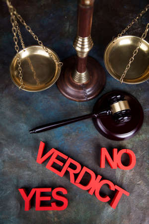 Law theme, mallet of the judge, justice scale, wooden desk backgroundの写真素材