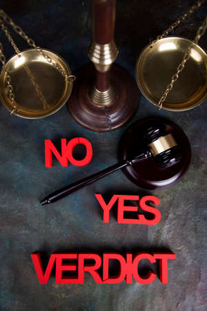 Law theme, mallet of the judge, justice scale, wooden desk backgroundの写真素材