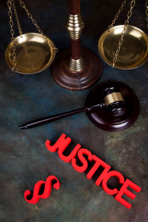 Judges wooden gavel, on wooden table backgroundの写真素材