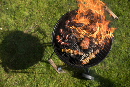 Assorted grilled meat on a summer barbecue, BBQ concept