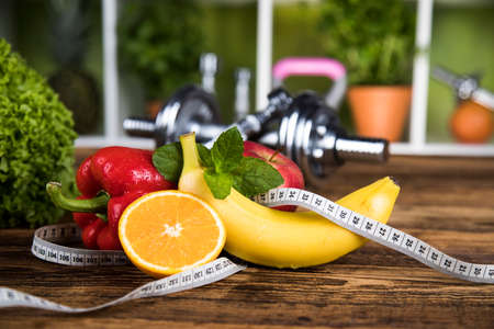 Diet and fitness, dumbbell with vitaminの写真素材