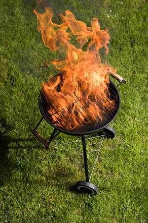 Barbecue grill with fire on nature, outdoor, close upの写真素材