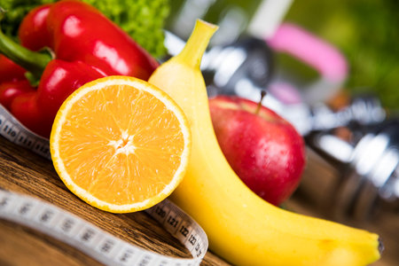 Diet and fitness, dumbbell with vitamin