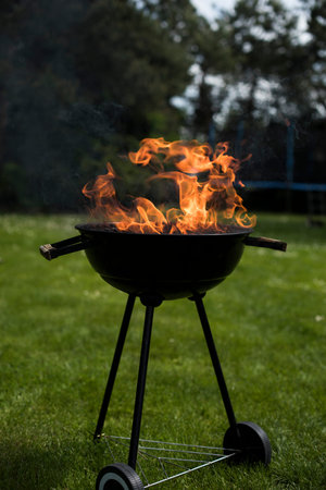 Grill on the garden, barbecue and fire background