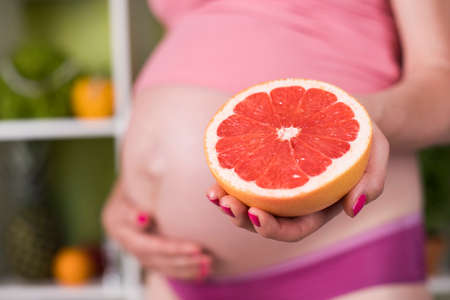 Pregnancy, healthy food and people conceptの写真素材