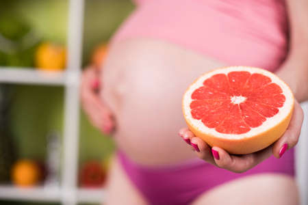 Pregnancy, healthy food and people conceptの写真素材