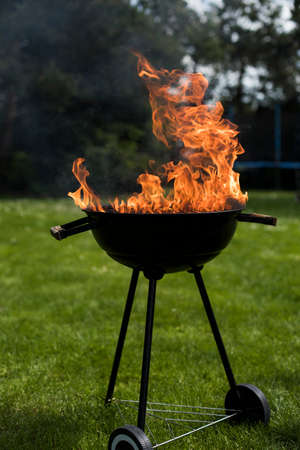 Grill on the garden, barbecue and fire backgroundの写真素材